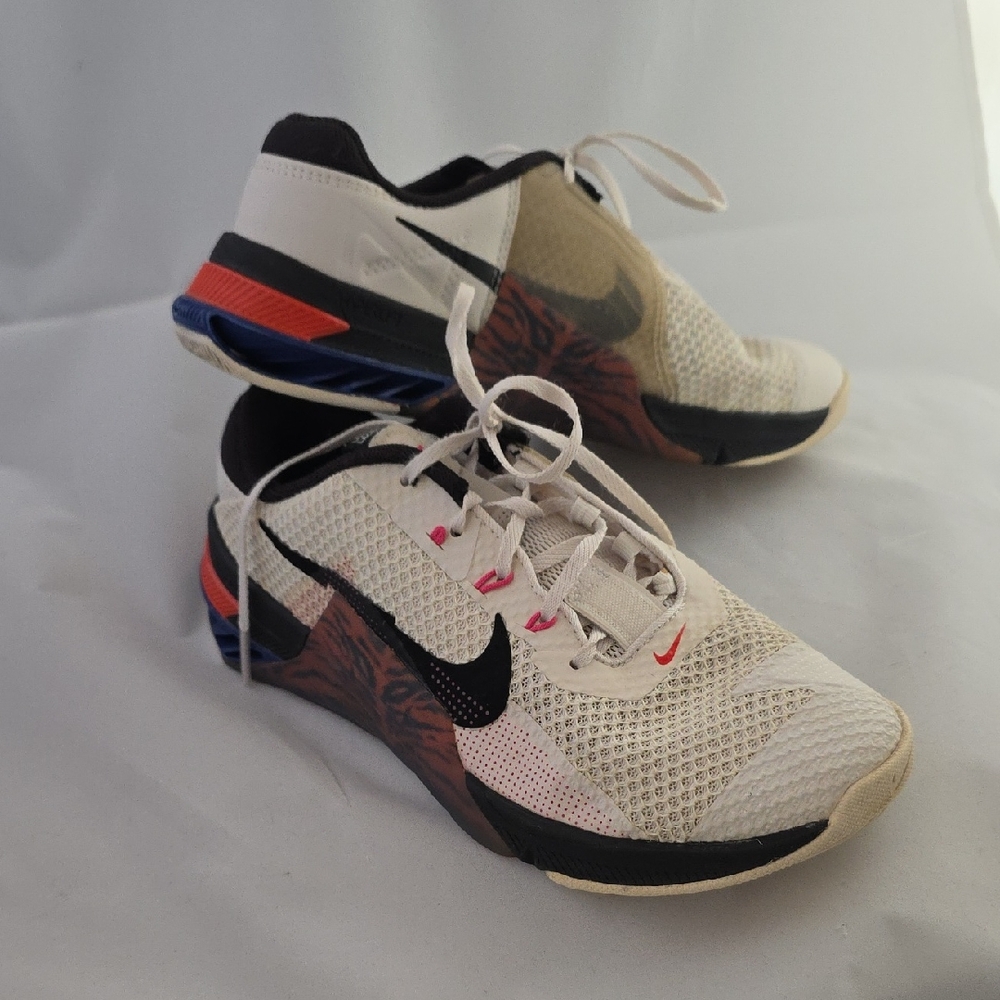 Nike Cream and Black Athletic Shoes with Red and Blue Accents